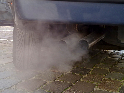 White smoke coming out of a car exhaust.